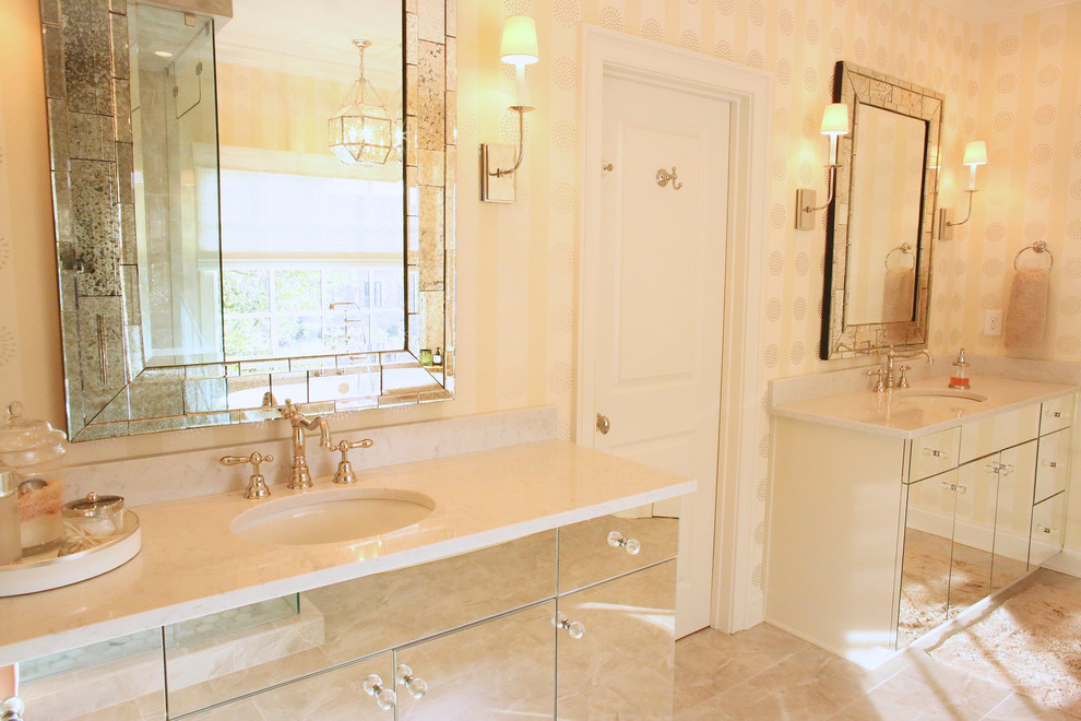 Inspiration for a large transitional master white tile, beige tile and porcelain tile marble floor freestanding bathtub remodel in Charlotte with recessed-panel cabinets, beige cabinets, a one-piece toilet, beige walls, an undermount sink and marble countertops