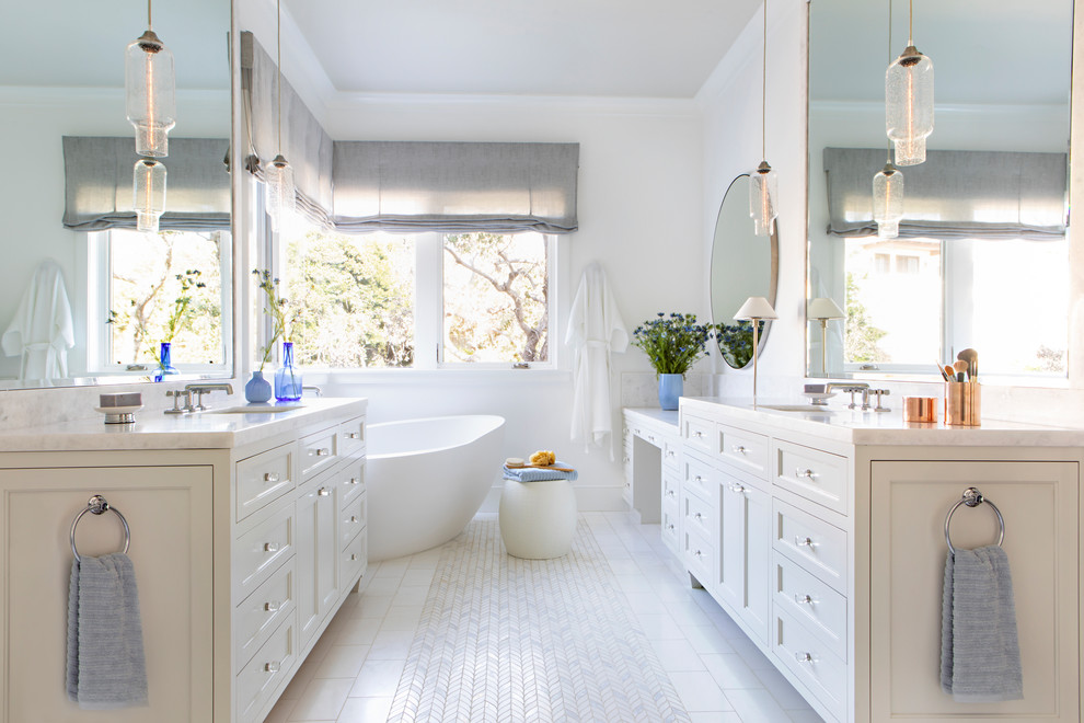 Design ideas for a small contemporary master bathroom in Los Angeles with recessed-panel cabinets, white cabinets, a freestanding tub, an alcove shower, a one-piece toilet, white tile, glass tile, white walls, mosaic tile floors, an undermount sink, marble benchtops, white floor, a hinged shower door and white benchtops.