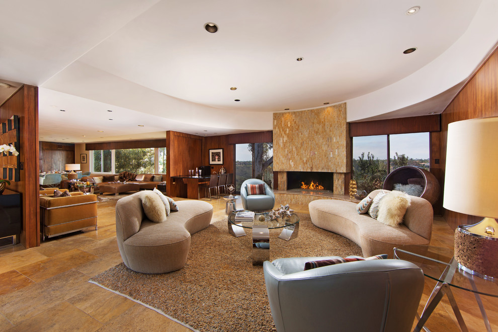This is an example of an expansive midcentury formal open concept living room in San Diego with beige walls and a tile fireplace surround.