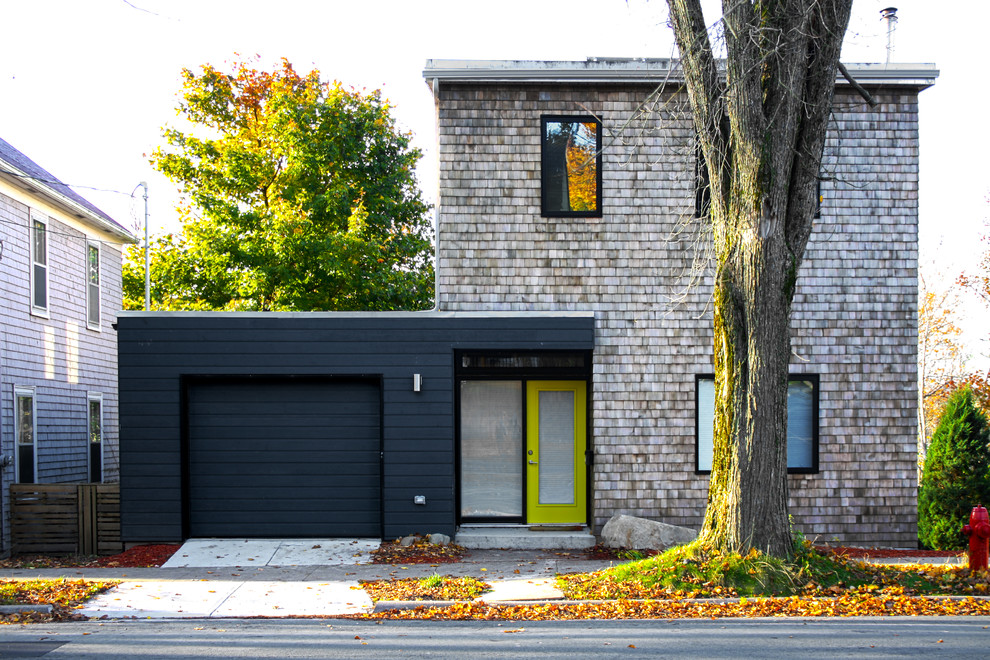 Mid-sized contemporary exterior in Other with wood siding.