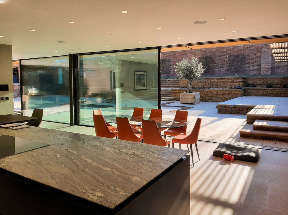 Inspiration for a large gray floor kitchen/dining room combo remodel with gray walls