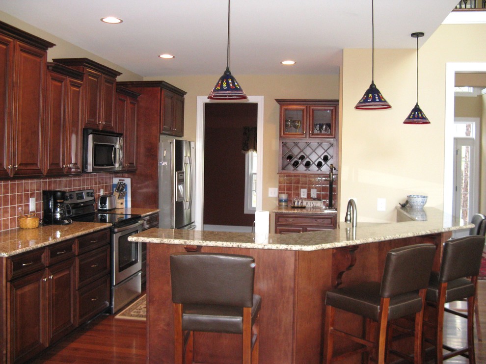 Example of a transitional kitchen design in Raleigh