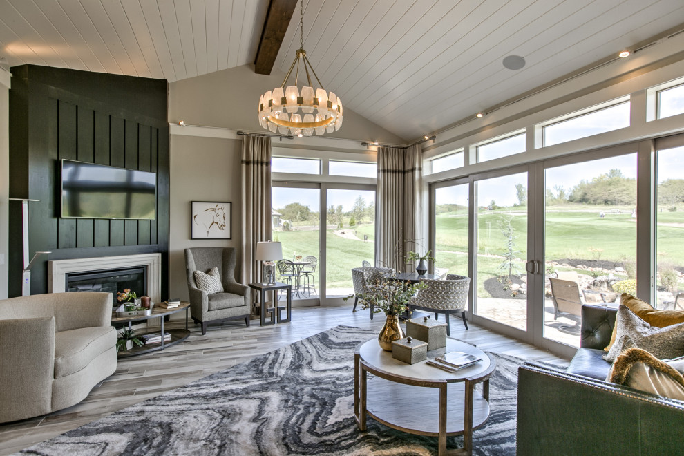 Mid-sized contemporary sunroom in Kansas City with laminate floors, a corner fireplace, a stone fireplace surround and grey floor.