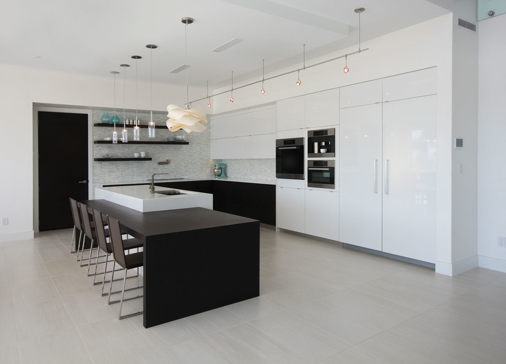 Contemporary l-shaped kitchen in Albuquerque with flat-panel cabinets, white cabinets and panelled appliances.