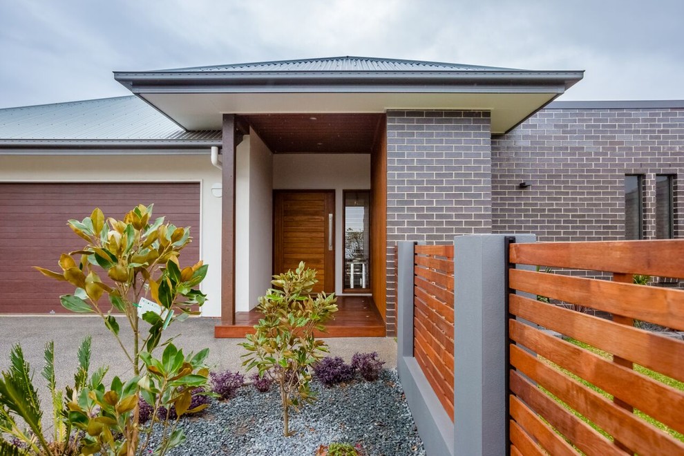 Design ideas for a small contemporary one-storey brick grey exterior in Brisbane.