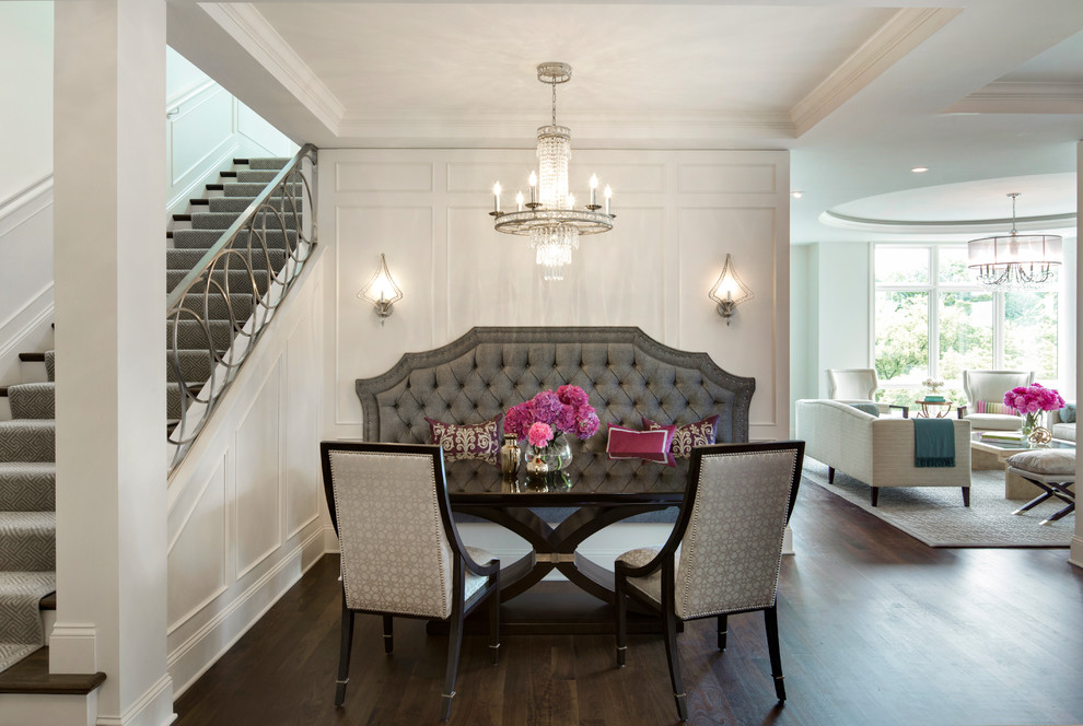 This is an example of a transitional open plan dining in Minneapolis with dark hardwood floors.
