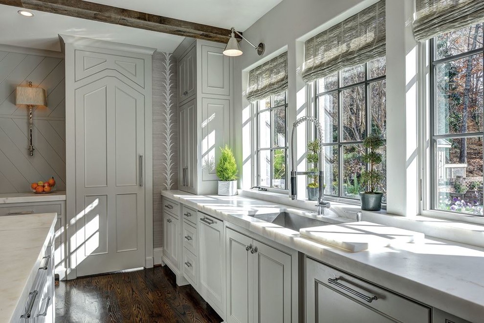 Inspiration for a large transitional l-shaped dark wood floor kitchen pantry remodel in Denver with a drop-in sink, shaker cabinets, white cabinets, laminate countertops, multicolored backsplash, mosaic tile backsplash, stainless steel appliances and an island