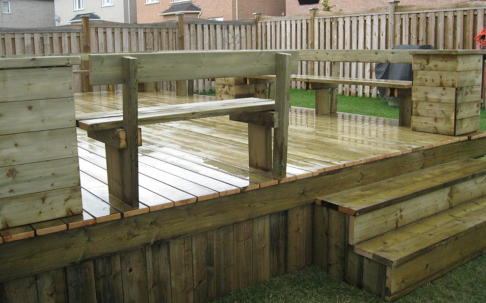 Photo of a small traditional backyard deck in Wichita with no cover.