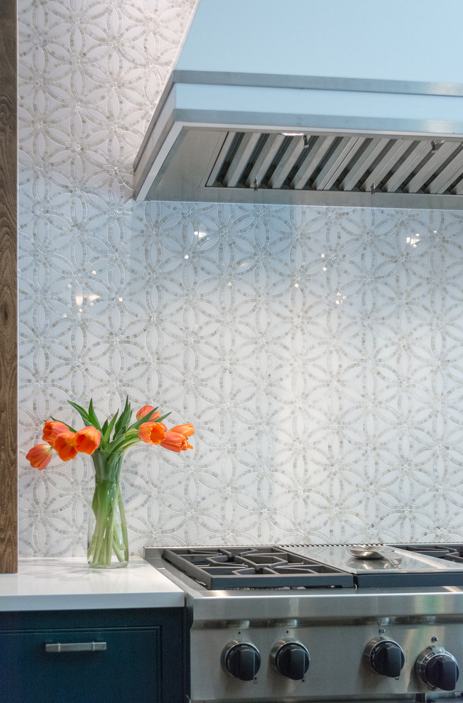 Example of a transitional kitchen design in Austin with white backsplash and stone tile backsplash