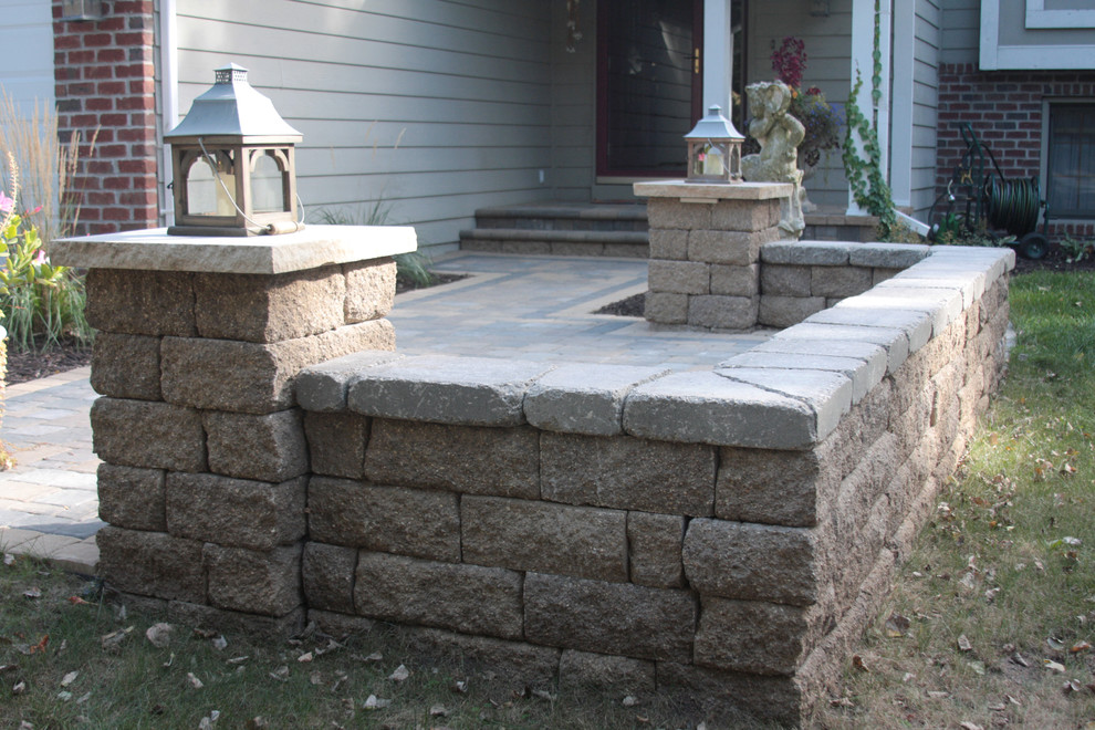 Design ideas for a small traditional front yard patio in Minneapolis with concrete pavers and no cover.