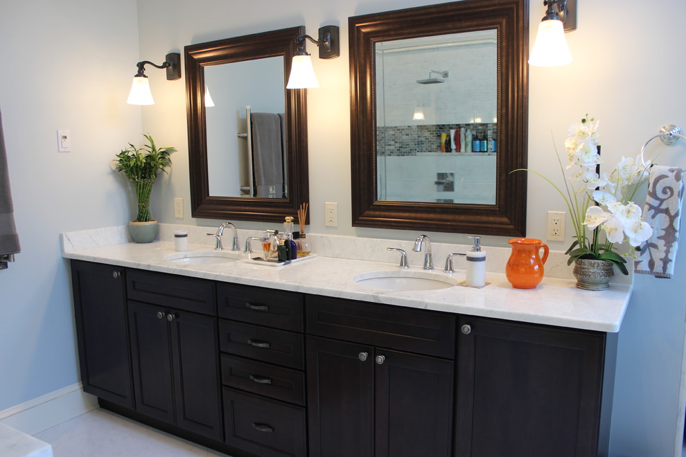 Inspiration for a large traditional master bathroom in Bridgeport with recessed-panel cabinets, dark wood cabinets, a claw-foot tub, a double shower, a two-piece toilet, white tile, ceramic tile, ceramic floors, an undermount sink, white walls and onyx benchtops.