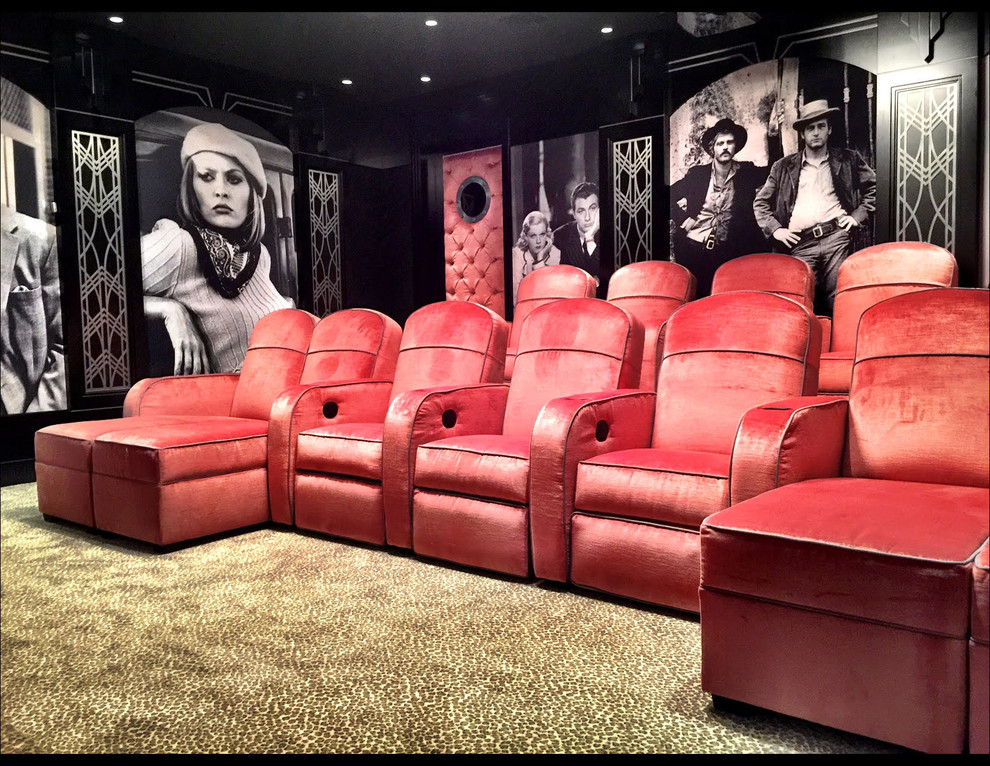 Photo of a large eclectic enclosed home theatre in New York with black walls, carpet, a projector screen and brown floor.