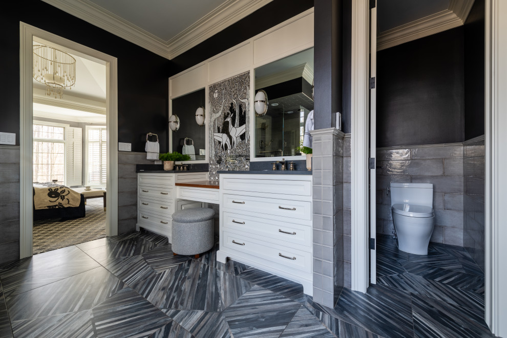 Photo of a large traditional ensuite bathroom in Cleveland with white cabinets, a freestanding bath, a corner shower, a one-piece toilet, grey tiles, stone slabs, black walls, ceramic flooring, a submerged sink, granite worktops, grey floors, a hinged door, white worktops, an enclosed toilet, double sinks, a built in vanity unit, a wood ceiling, wallpapered walls and recessed-panel cabinets.