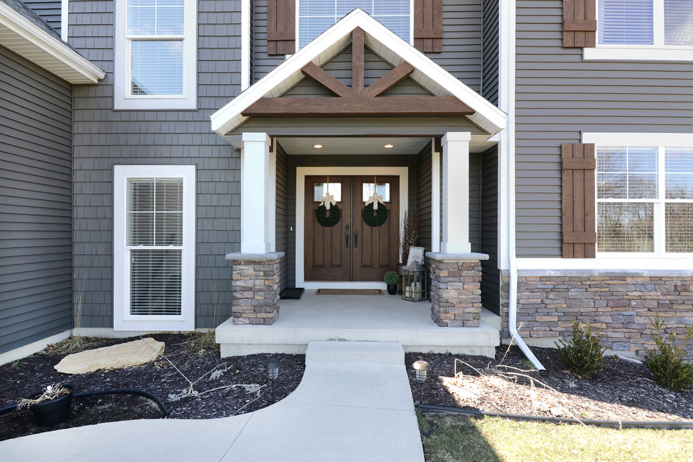 Mid-sized transitional front door photo in Grand Rapids with gray walls and a dark wood front door