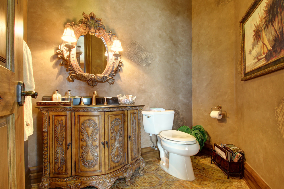 Inspiration for a large traditional master bathroom in Tampa with raised-panel cabinets, dark wood cabinets, marble benchtops, a drop-in tub, a corner shower, beige walls and ceramic floors.
