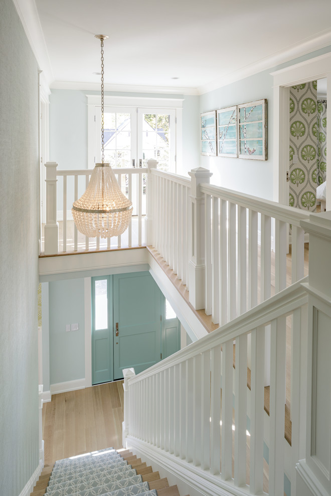 Inspiration for a mid-sized arts and crafts foyer in Portland with green walls, light hardwood floors, a single front door, a green front door and brown floor.