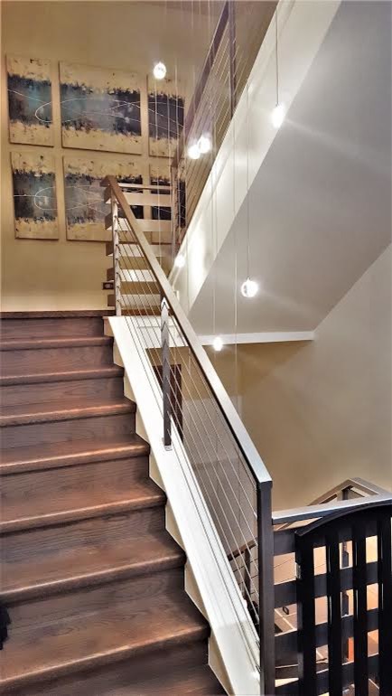 Inspiration for a large transitional u-shaped staircase remodel in Denver