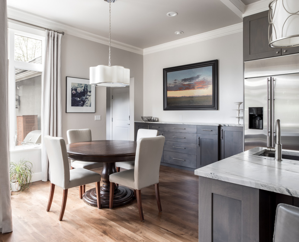 Example of a transitional kitchen design in Denver