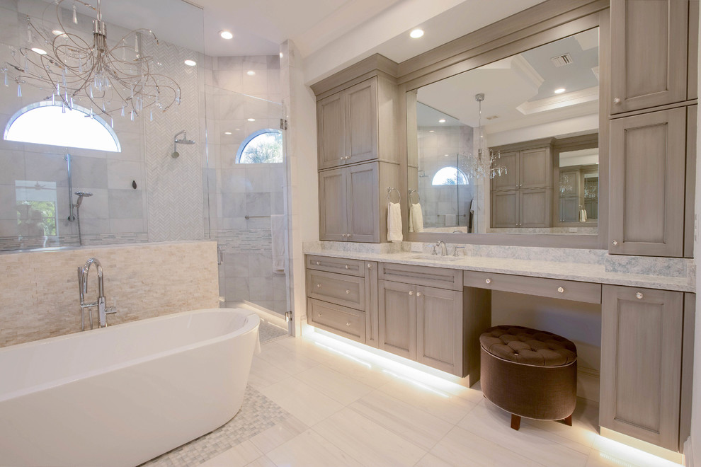 Freestanding bathtub - huge transitional master white tile and porcelain tile porcelain tile and white floor freestanding bathtub idea with shaker cabinets, a two-piece toilet, gray walls, an undermount sink, quartz countertops, a hinged shower door and gray cabinets