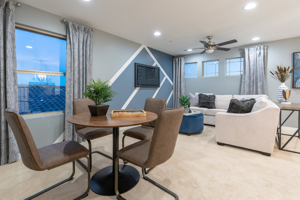 Inspiration for a mid-sized transitional loft-style family room in Phoenix with a game room, blue walls, carpet, a wall-mounted tv and beige floor.