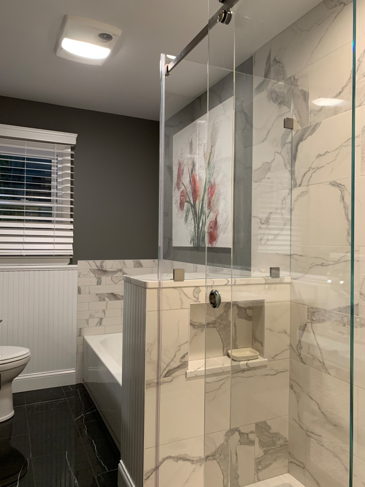 Design ideas for a medium sized modern ensuite bathroom in Newark with an alcove bath, a shower/bath combination, a two-piece toilet, porcelain tiles, green walls, porcelain flooring, a wall-mounted sink, a sliding door, a wall niche, a single sink and a floating vanity unit.