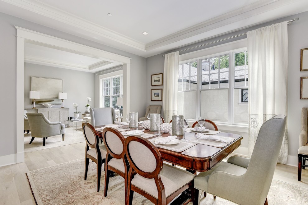This is an example of a mid-sized arts and crafts separate dining room in DC Metro with grey walls, light hardwood floors, no fireplace and white floor.