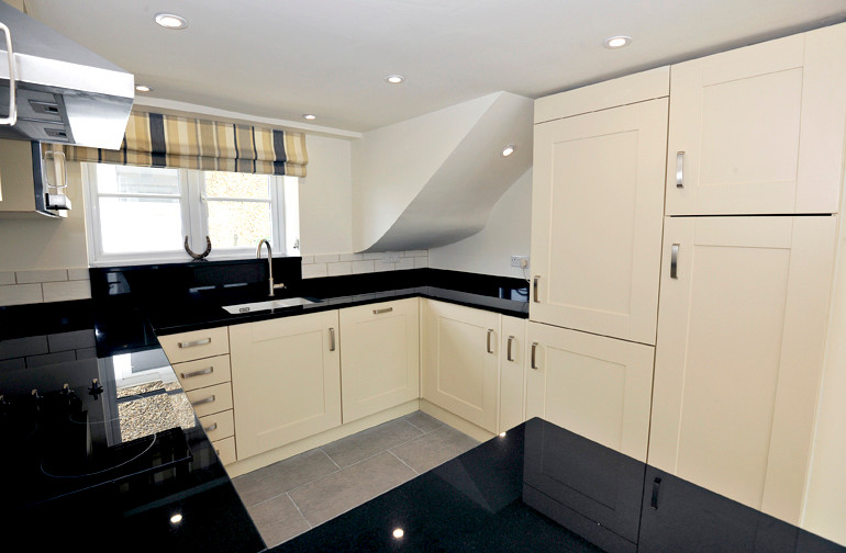 Small transitional home design in Hertfordshire.