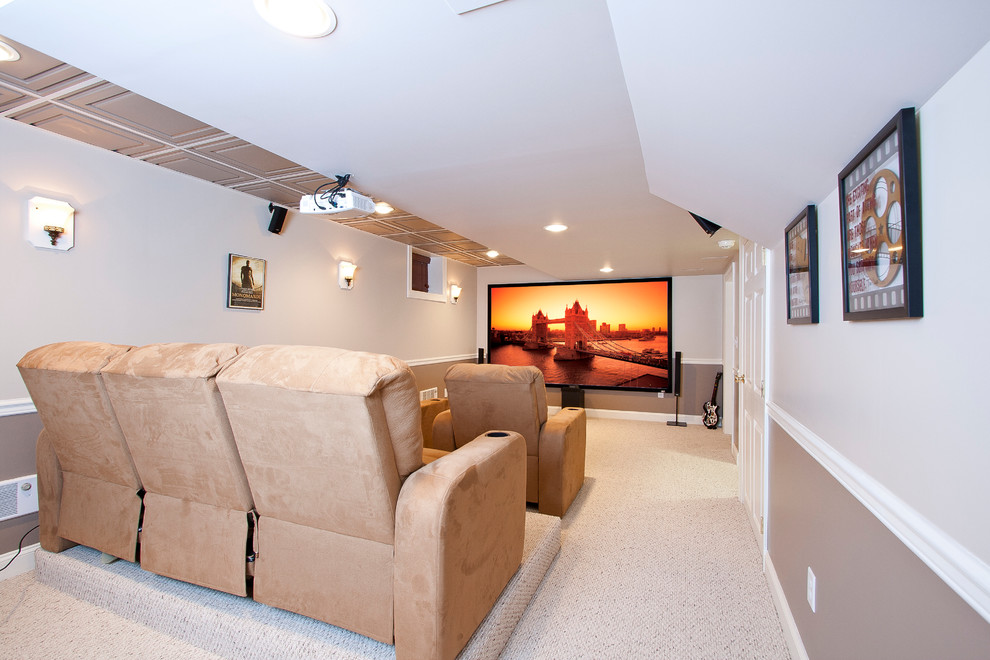 Photo of a mid-sized traditional enclosed home theatre in Newark with multi-coloured walls, carpet, a projector screen and beige floor.
