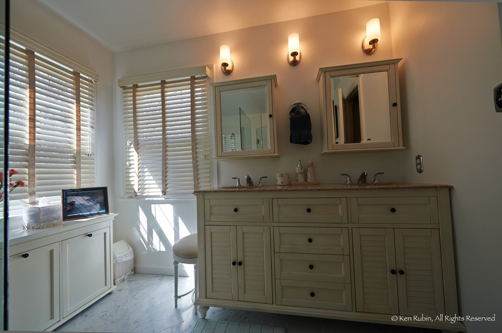 Example of a large transitional master gray tile, white tile and stone tile marble floor corner shower design in DC Metro with recessed-panel cabinets, white cabinets, a two-piece toilet, white walls, an undermount sink and granite countertops