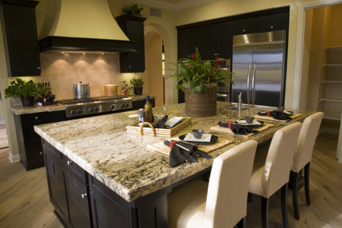 Absolute Cream Granite Countertop and travertine back splashes