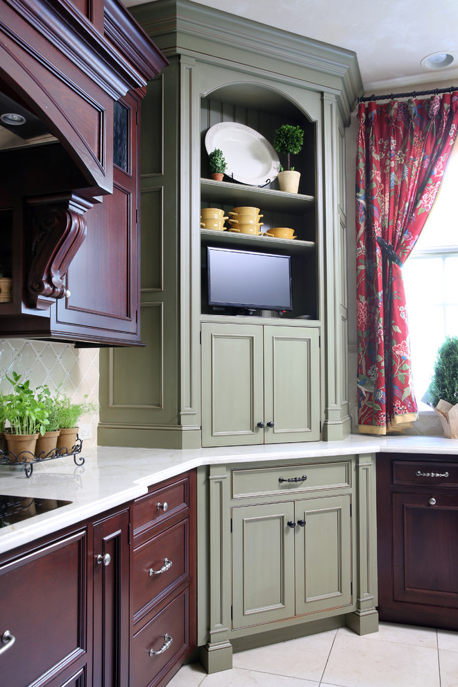 Inspiration for a large traditional u-shaped eat-in kitchen in Chicago with recessed-panel cabinets, green cabinets, beige splashback and ceramic splashback.