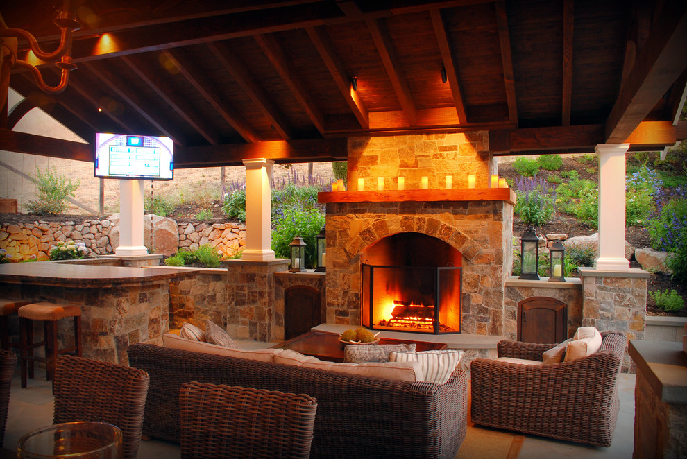 Inspiration for a large traditional backyard patio in San Francisco with a fire feature, concrete pavers and a gazebo/cabana.