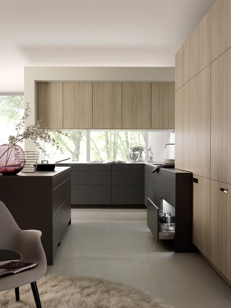 Design ideas for a mid-sized contemporary u-shaped eat-in kitchen in Boston with an undermount sink, flat-panel cabinets, dark wood cabinets, quartz benchtops, stainless steel appliances and with island.