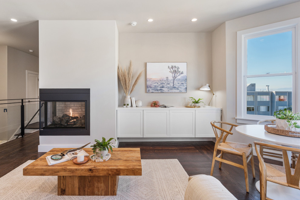 Photo of a contemporary living room in San Francisco with a corner fireplace.