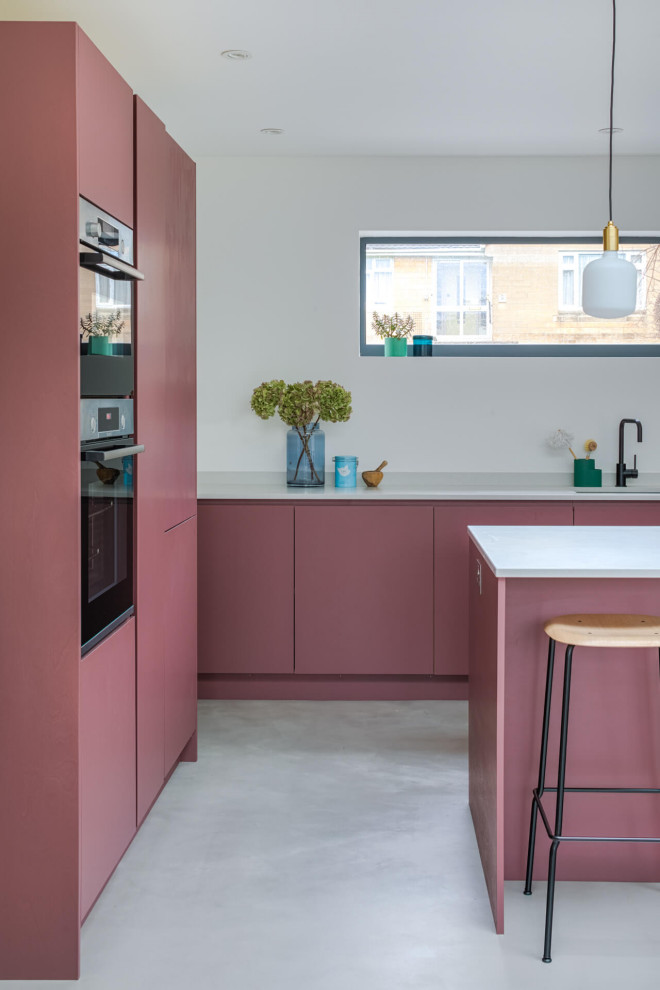 Design ideas for a mid-sized contemporary l-shaped eat-in kitchen in Other with a drop-in sink, flat-panel cabinets, purple cabinets, quartzite benchtops, white splashback, concrete floors, with island, grey floor and white benchtop.