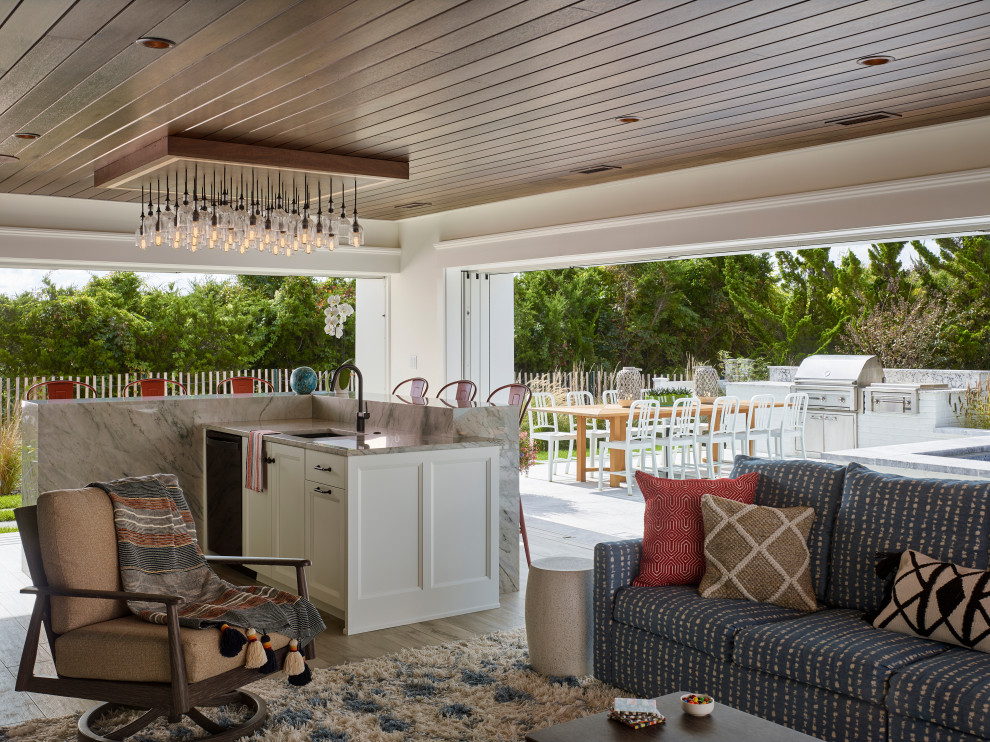 Example of a huge transitional backyard pool house design