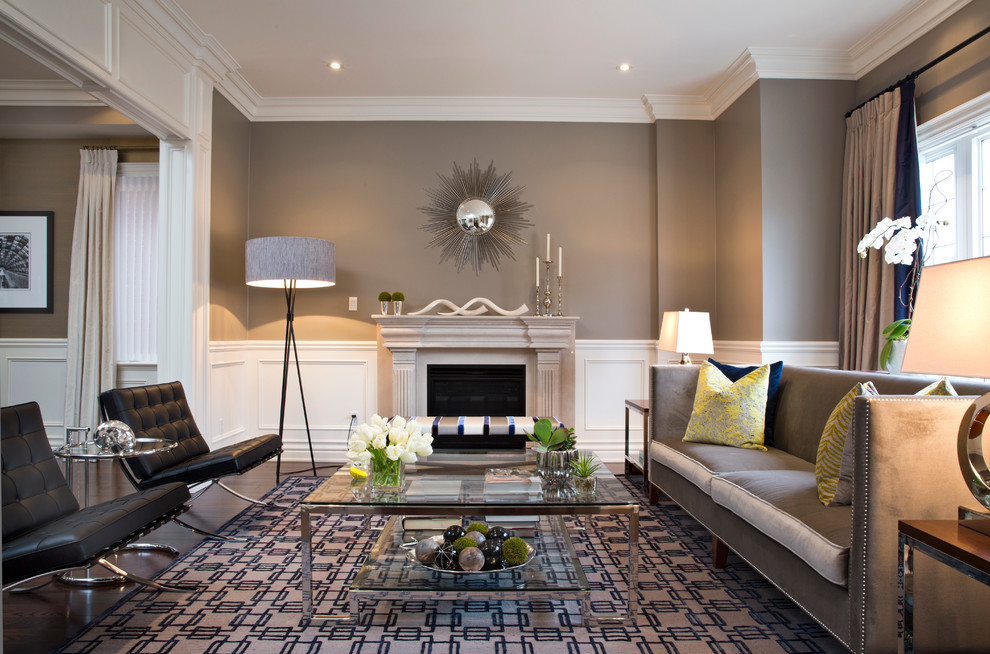 Contemporary living room in Toronto with grey walls and a standard fireplace.