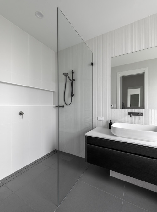 Contemporary Finesse: Monochromatic Look with White Shower Wall Tiles for a Stylish Bathroom