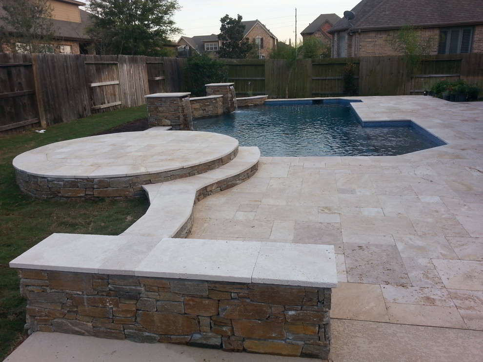 Photo of a mid-sized transitional backyard custom-shaped lap pool in Orlando with a hot tub and tile.