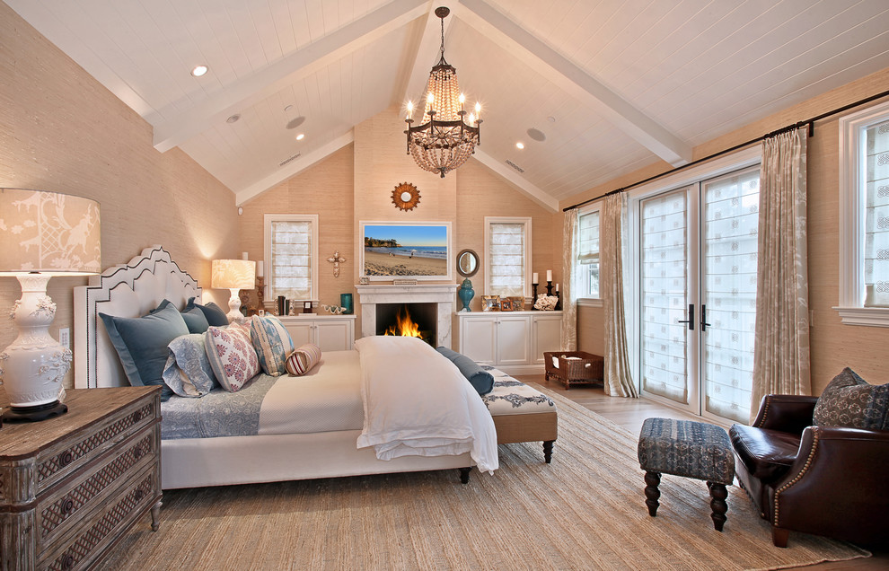 Inspiration for a traditional bedroom in Orange County with beige walls and a standard fireplace.
