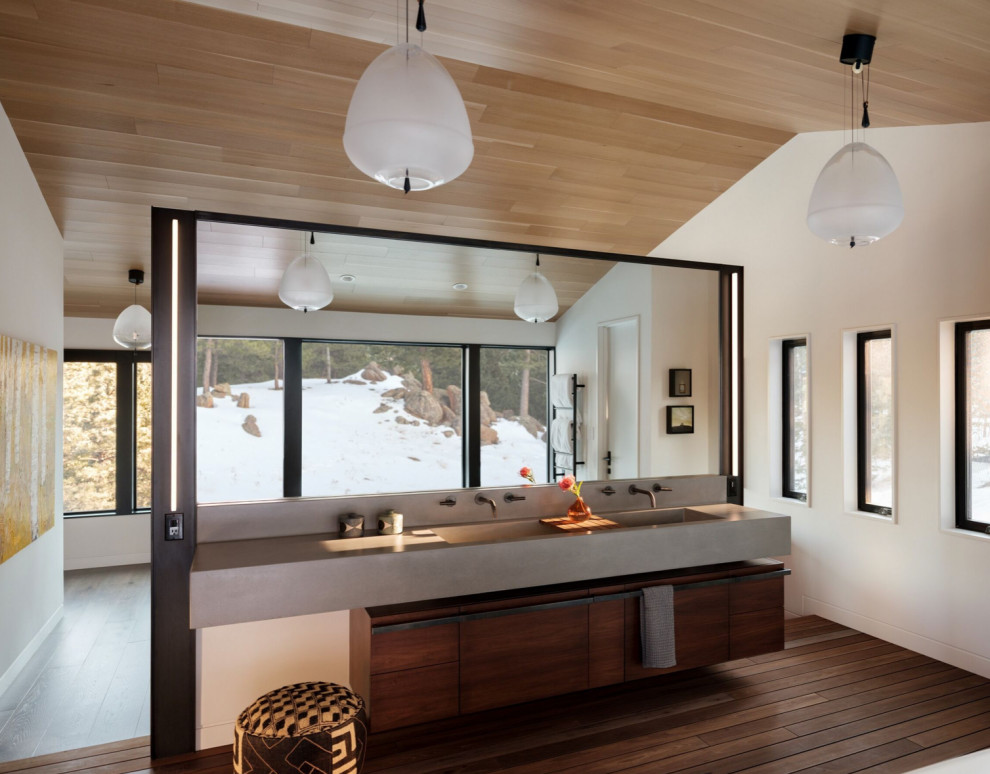 Design ideas for a contemporary bathroom in Denver with flat-panel cabinets, dark wood cabinets, white walls, dark hardwood floors, an integrated sink, brown floor, grey benchtops, a double vanity, a floating vanity, vaulted and wood.