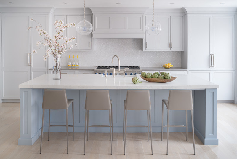 Inspiration for a large transitional single-wall laminate floor and beige floor eat-in kitchen remodel in DC Metro with a farmhouse sink, flat-panel cabinets, blue cabinets, quartz countertops, white backsplash, mosaic tile backsplash, stainless steel appliances, an island and gray countertops