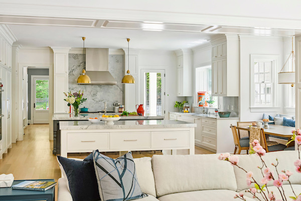 Kitchen - huge transitional u-shaped kitchen idea in DC Metro with white cabinets, wood countertops, multicolored backsplash, granite backsplash, paneled appliances, two islands and multicolored countertops