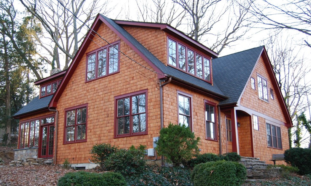 This is an example of a mid-sized arts and crafts two-storey brown house exterior in Baltimore with wood siding, a gable roof and a shingle roof.