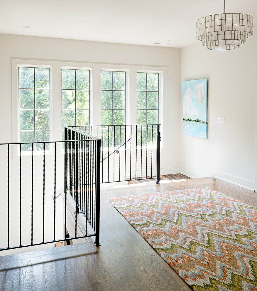 Example of a mid-sized transitional dark wood floor hallway design in Nashville with white walls