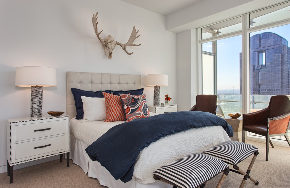 Contemporary guest bedroom in Dallas with white walls and carpet.