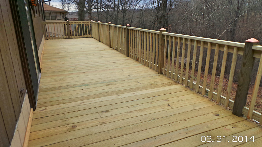 Inspiration for a mid-sized backyard deck remodel with decking and no cover