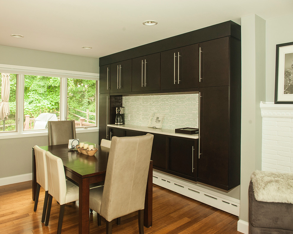 Inspiration for a kitchen remodel in Chicago with flat-panel cabinets, dark wood cabinets and two islands