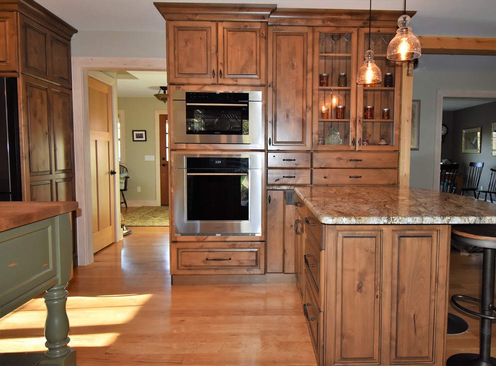 Huge mountain style kitchen photo with distressed cabinets