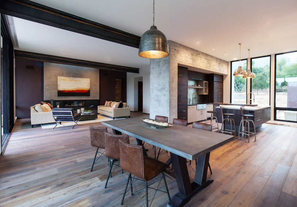Inspiration for a mid-sized contemporary open plan dining in Santa Barbara with grey walls and dark hardwood floors.